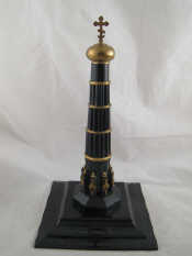 Appraisal: A bakelite and brass Russian column surmounted by an Orthodox