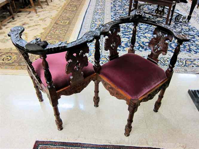 Appraisal: RENAISSANCE STYLE CARVED WOOD TETE-A-TETE SETTEE a companion or conversation