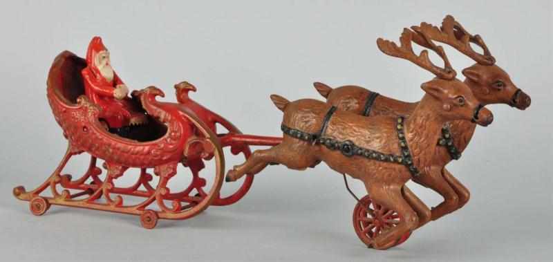 Appraisal: Cast Iron Santa Claus Sleigh Horse-Drawn Toy Description Made by