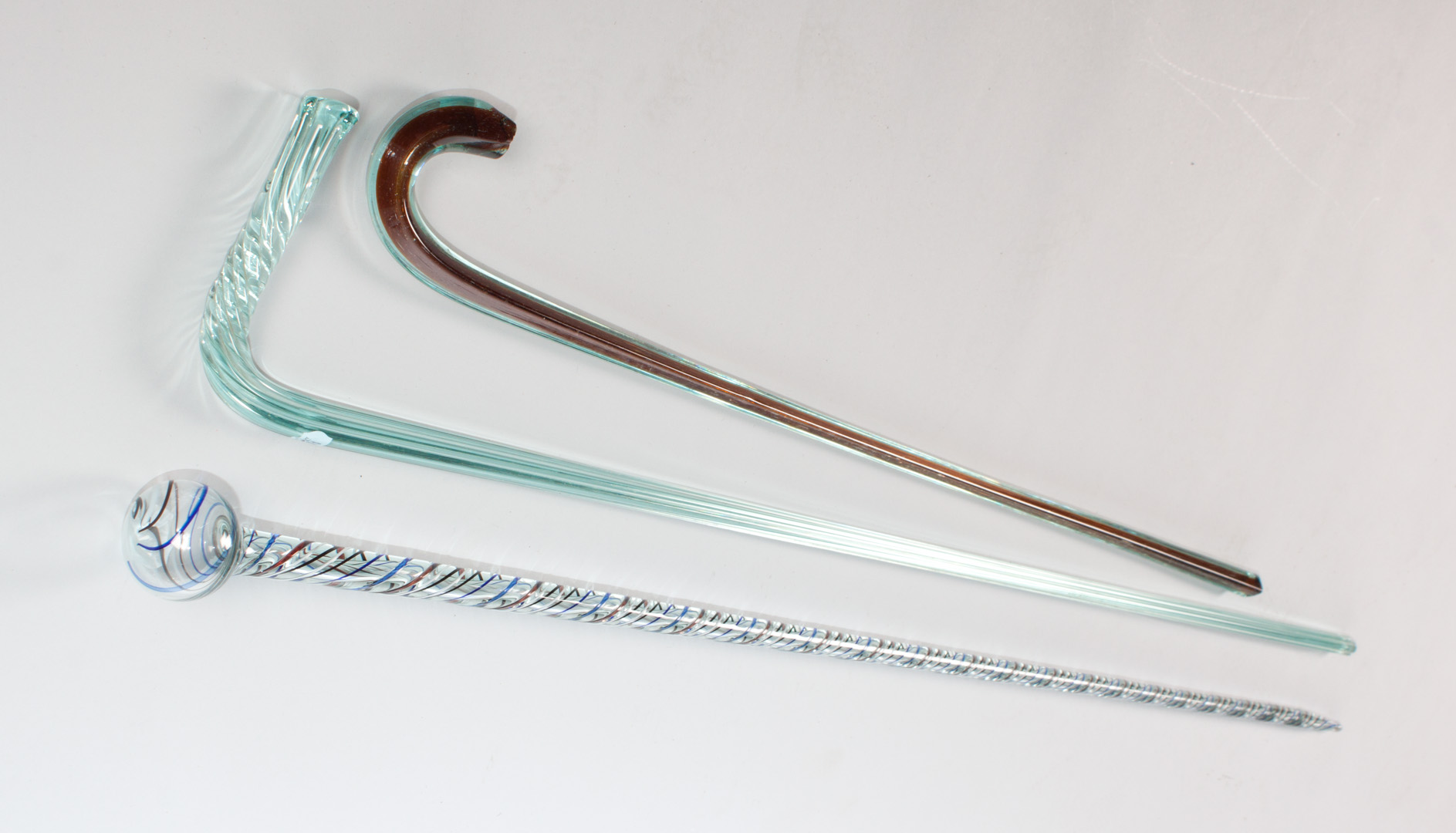 Appraisal: Three glass parade canes first half- th century blown glass