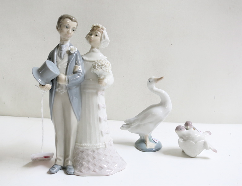 Appraisal: THREE LLADRO FIGURINES of soft paste porcelain Wedding Julio Fernandez