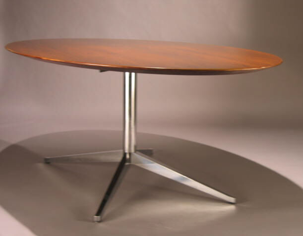 Appraisal: FLORENCE KNOLL Rosewood pedestal table raised on four-point chromed pedestal