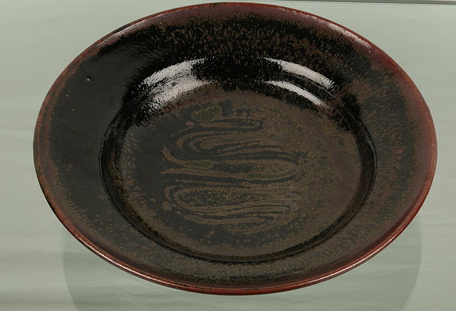 Appraisal: Henry Hammond British - Dishcombed wave decoration tenmoku glazeimpressed potter's