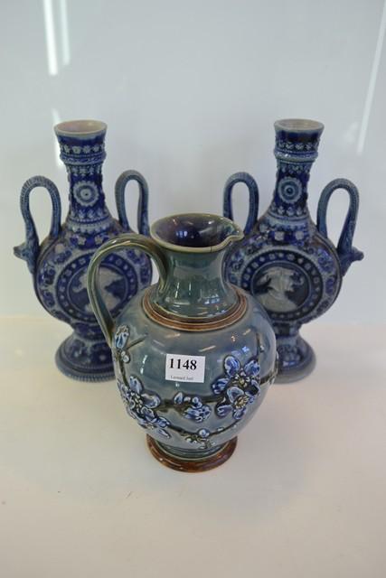 Appraisal: A PAIR OF MAJOLICA TWIN HANDLED VASES AND A DOULTON