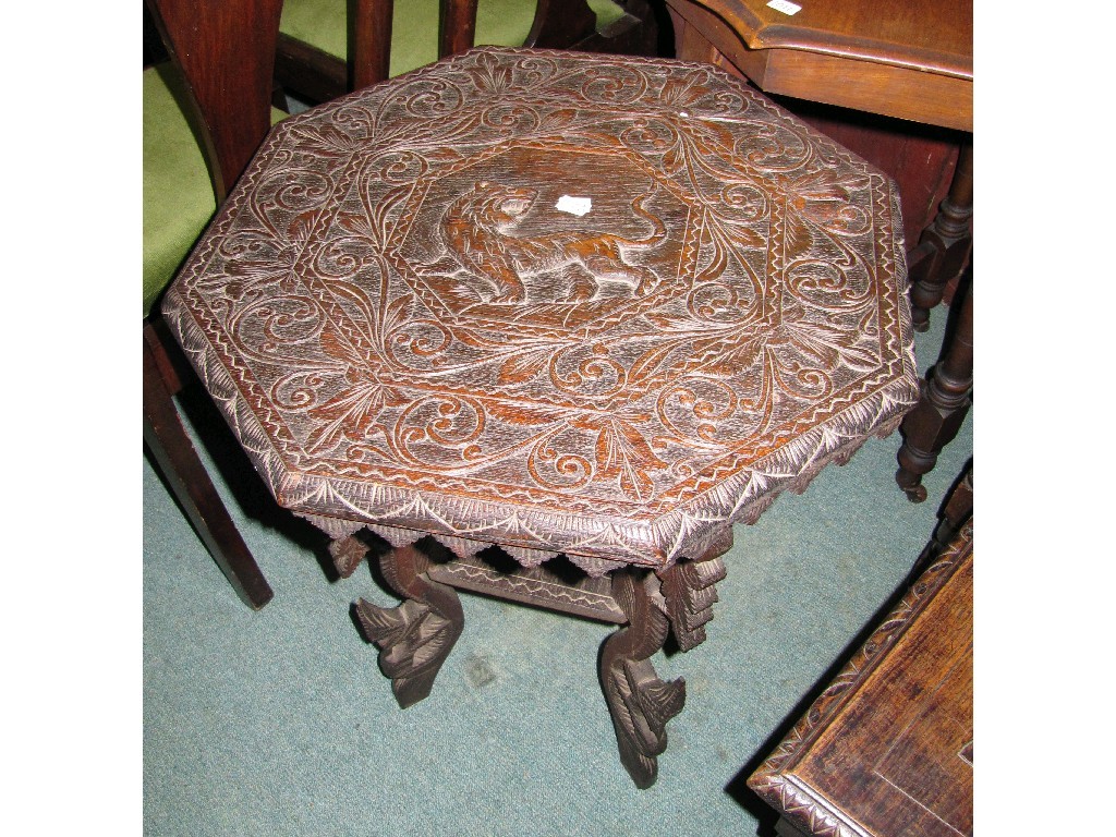 Appraisal: Carved hardwood occasional table