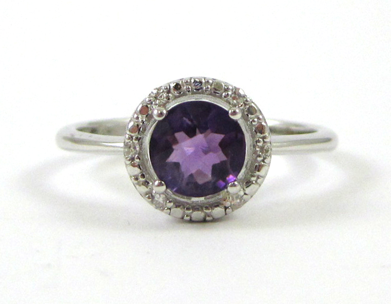 Appraisal: FOURTEEN KARAT WHITE GOLD AMETHYST AND DIAMOND RING round checkerboard-cut