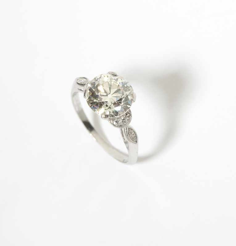 Appraisal: A diamond and platinum ring Centering an old European-cut diamond