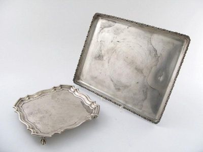 Appraisal: A modern rectangular salver with a raised floral border by