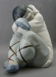 Appraisal: A Lladro figure modeled as a crouched eskimo cm tall