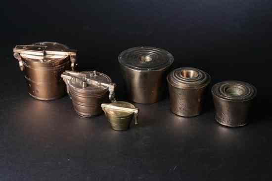 Appraisal: SIX BRASS NESTING WEIGHTS th- th century Of various sizes