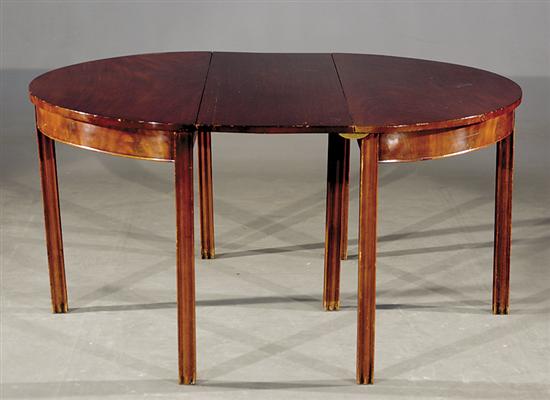 Appraisal: English Chippendale mahogany dining table circa pair elliptical tops one