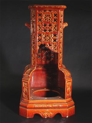 Appraisal: A Burmantoft's Faience Veritas oil stove decorated with pierced panels