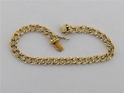 Appraisal: An carat gold and diamond curb link bracelet the flattened