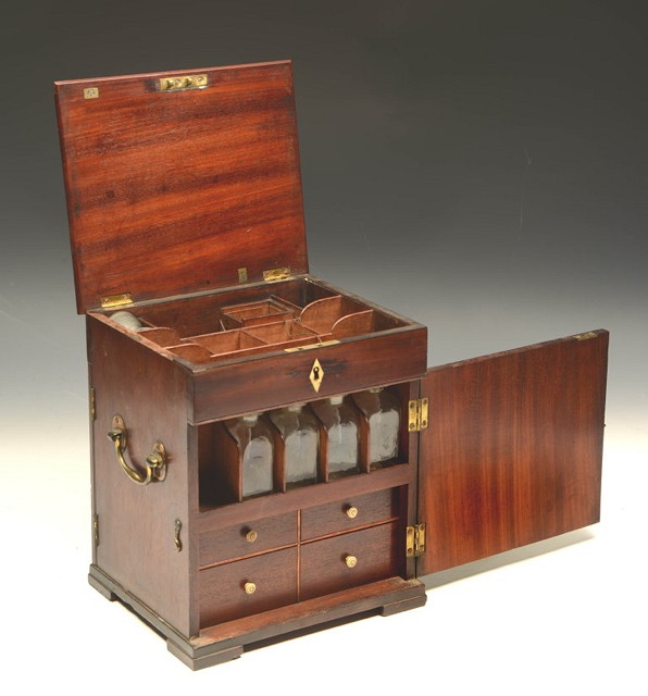 Appraisal: A GEORGE III APOTHECARY'S CABINET with lift-up top revealing open