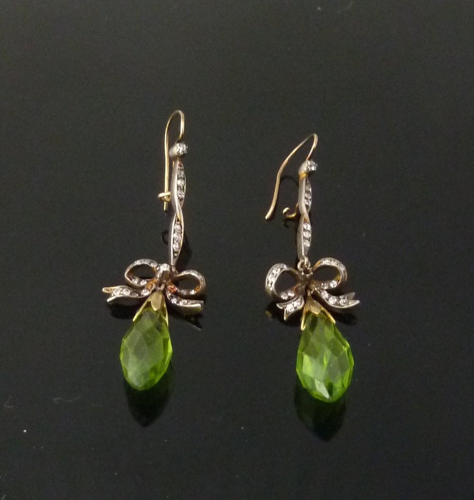 Appraisal: A pair of peridot and diamond ear pendants the diamond