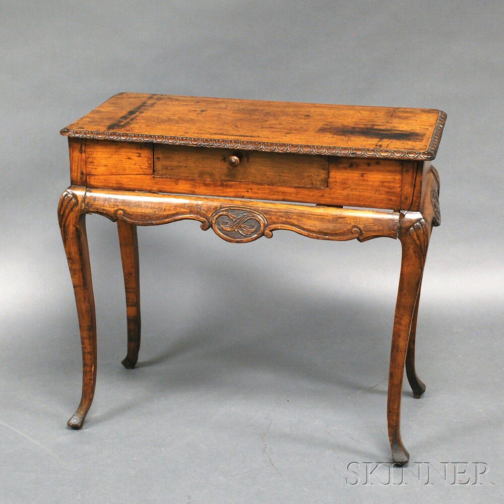 Appraisal: French Provincial Carved Fruitwood Side Table the carved rectangular top