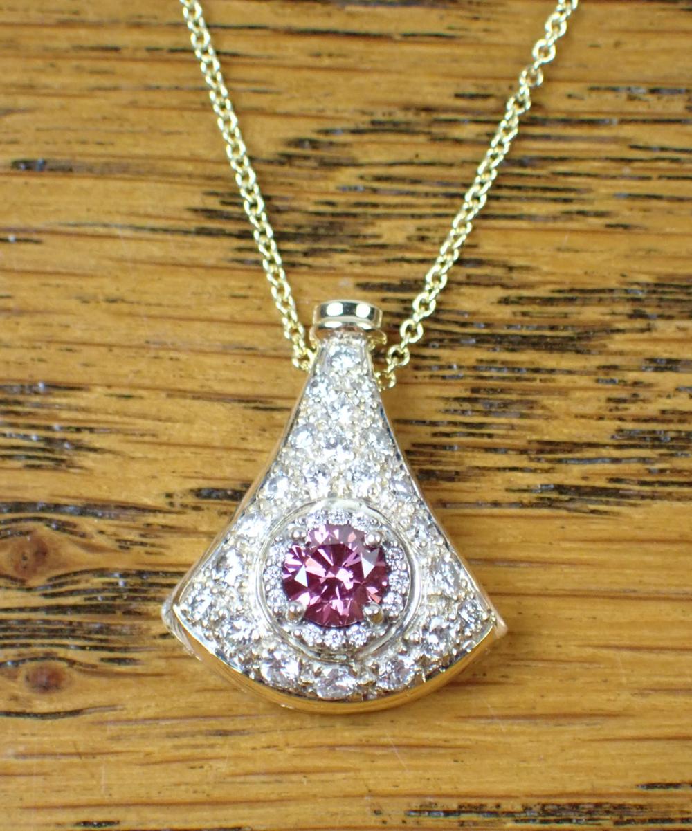 Appraisal: DIAMOND AND EIGHTEEN KARAT GOLD PENDANT NECKLACE the pie-shaped pendant