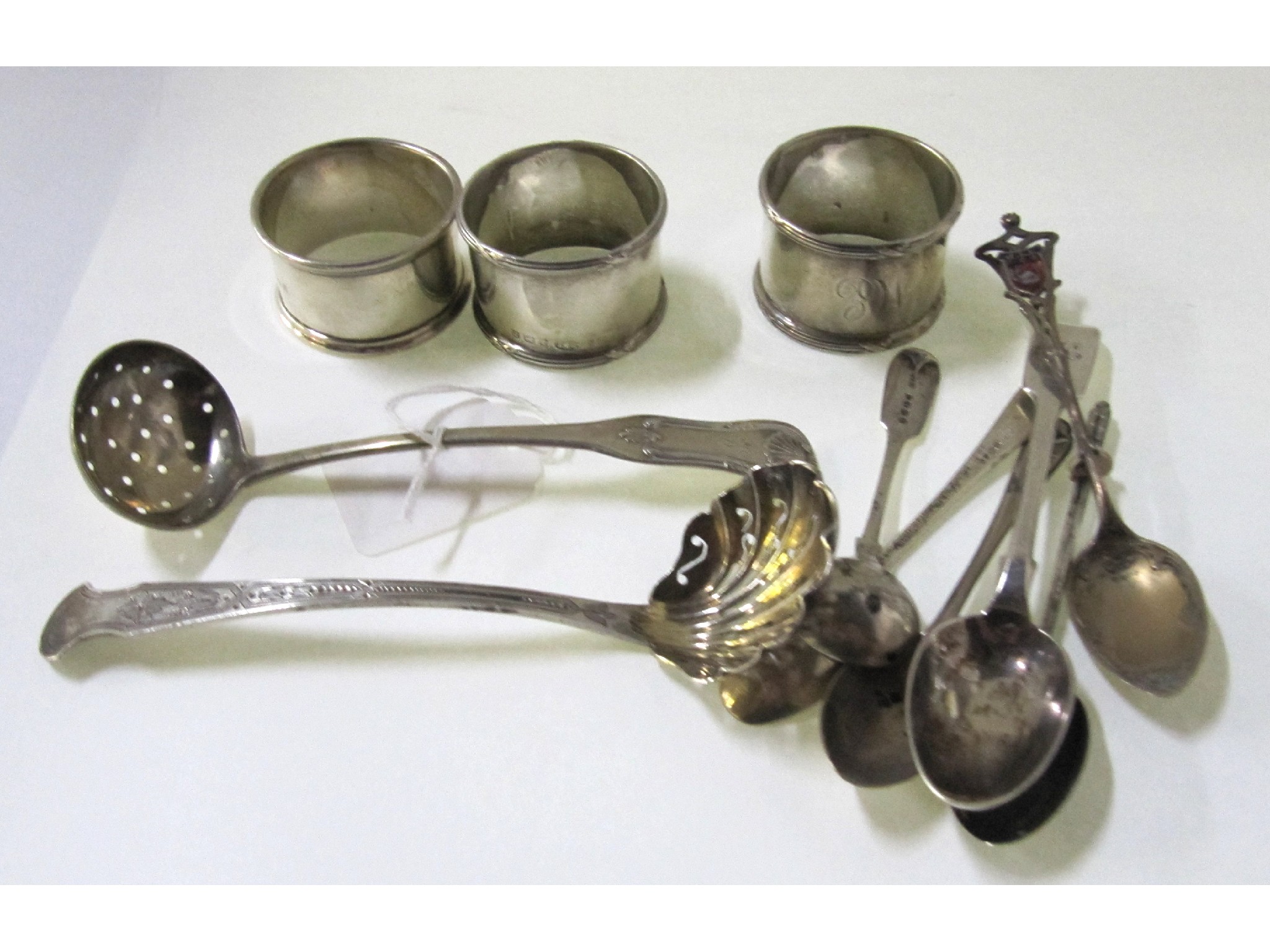 Appraisal: A lot comprising three silver napkin rings with assorted silver