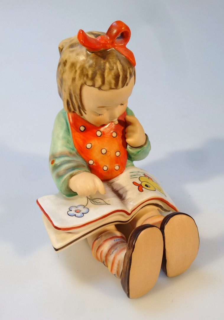 Appraisal: A Goebel Hummel figure girl reading predominately in green and