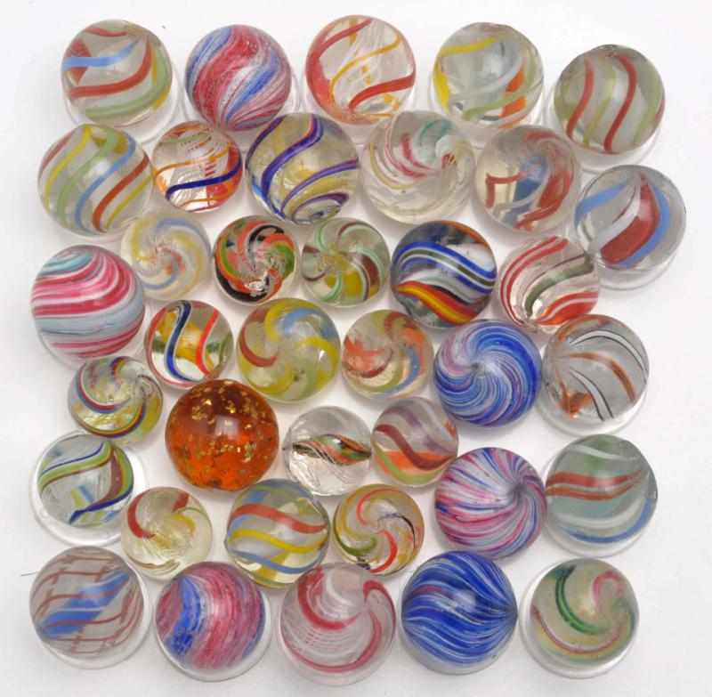 Appraisal: Lot of Handmade Marbles Description Includes latticinos solid cores divided