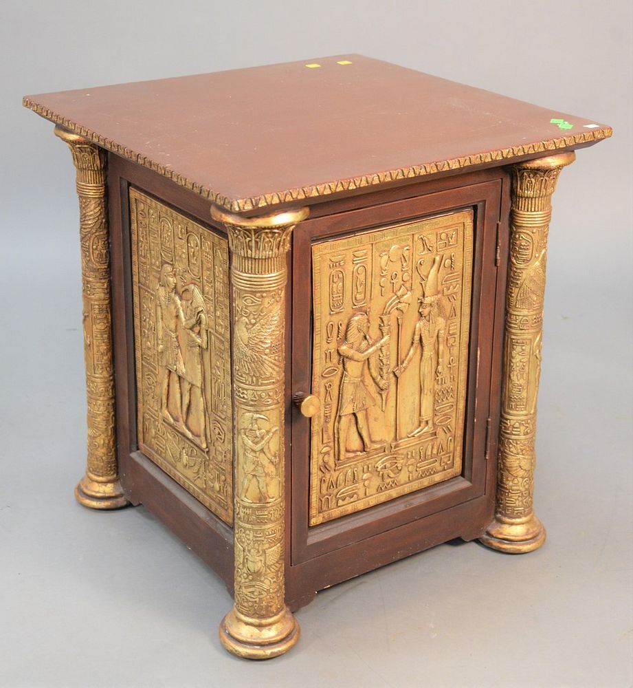 Appraisal: Egyptian-style low cabinet having one door with embossed panels ht