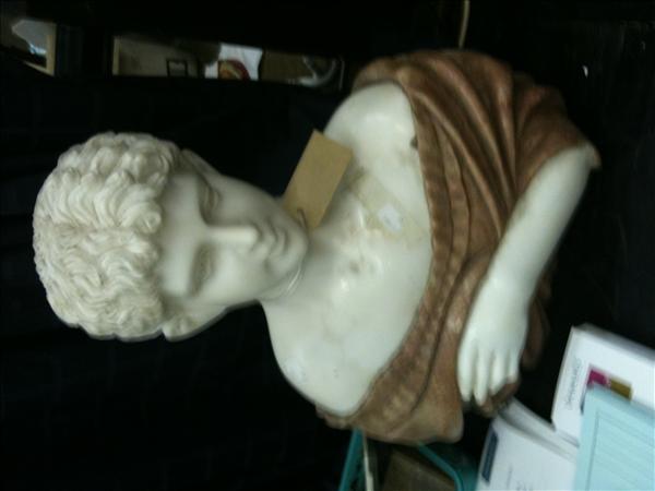 Appraisal: A head and shoulders marble bust of a Roman boy