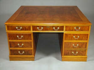 Appraisal: A walnut and figured walnut twin pedestal partners desk late