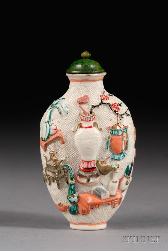 Appraisal: Relief Decorated Porcelain Snuff Bottle China th century design of