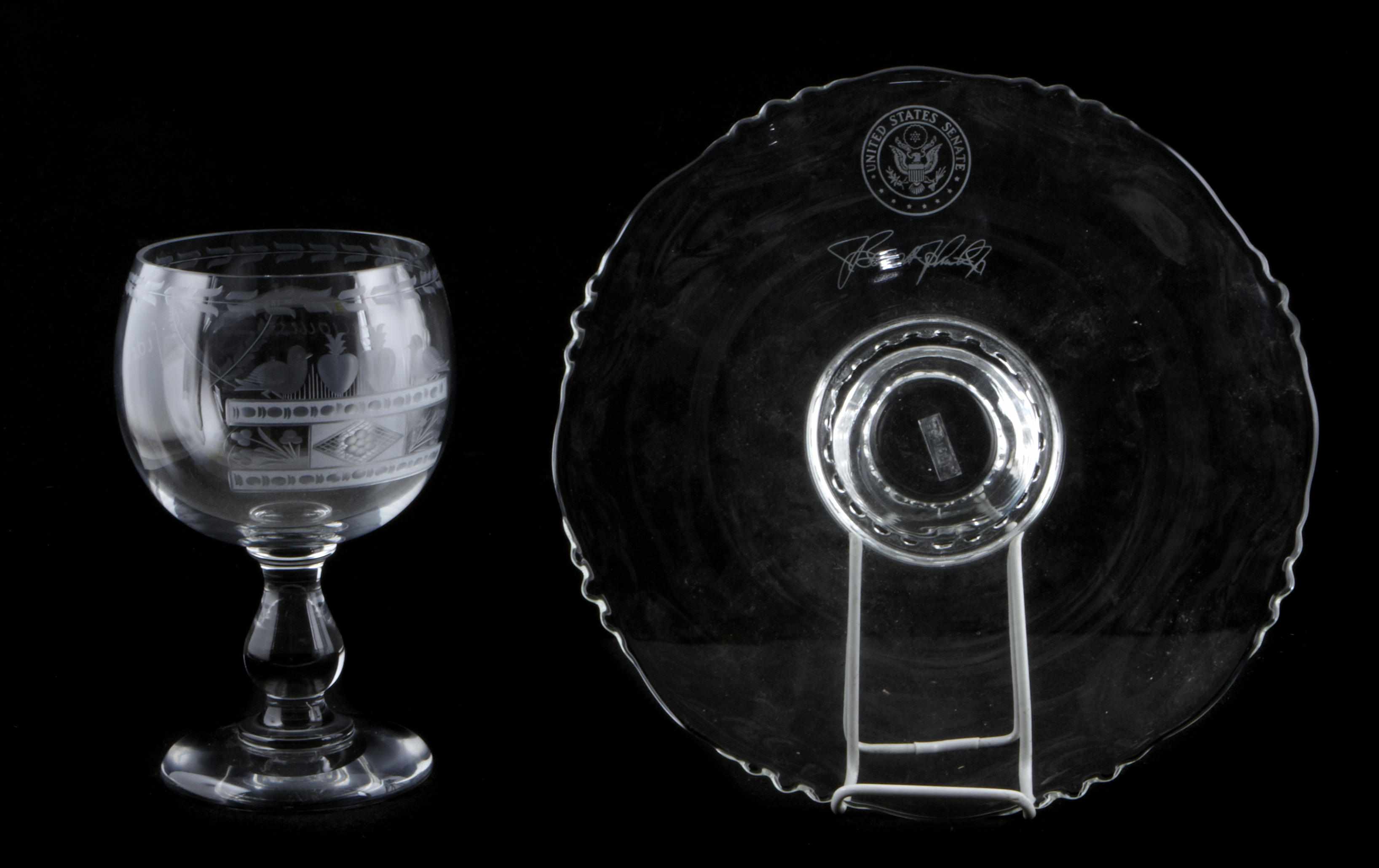 Appraisal: A large etched glass goblet and a Fostoria glass footed