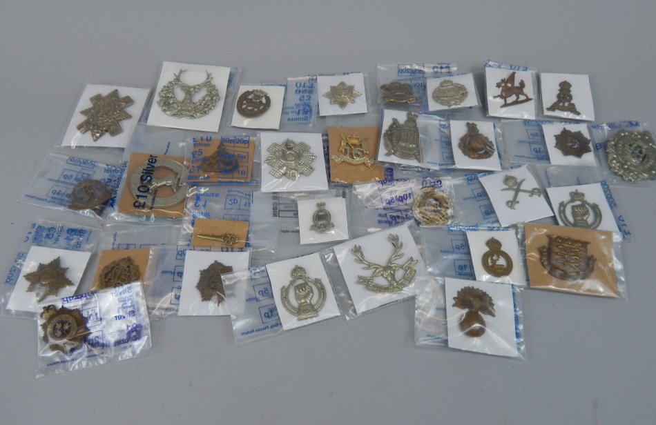 Appraisal: Various military cap badges to include The Welsh Regiment Tank