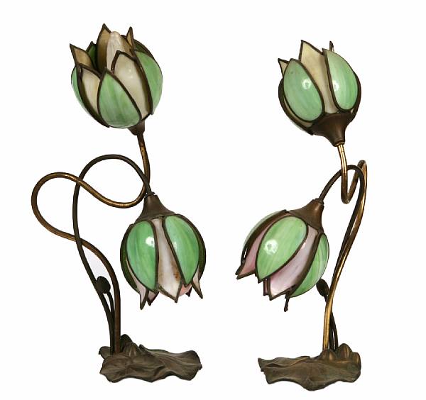 Appraisal: A pair of Handel style two-light Lotus lamps s height