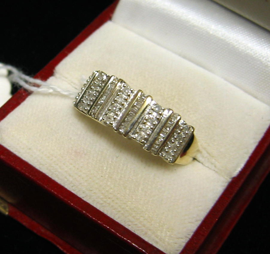 Appraisal: DIAMOND AND FOURTEEN KARAT YELLOW AND WHITE GOLD RING set