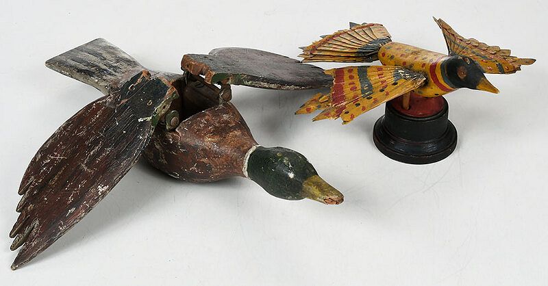 Appraisal: Two Folk Art Carved and Painted Birds probably American late