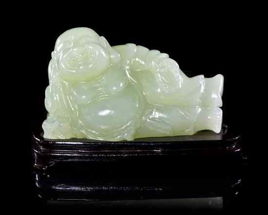 Appraisal: A Carved Hardstone Model of a Happy Buddha of semi-transparent