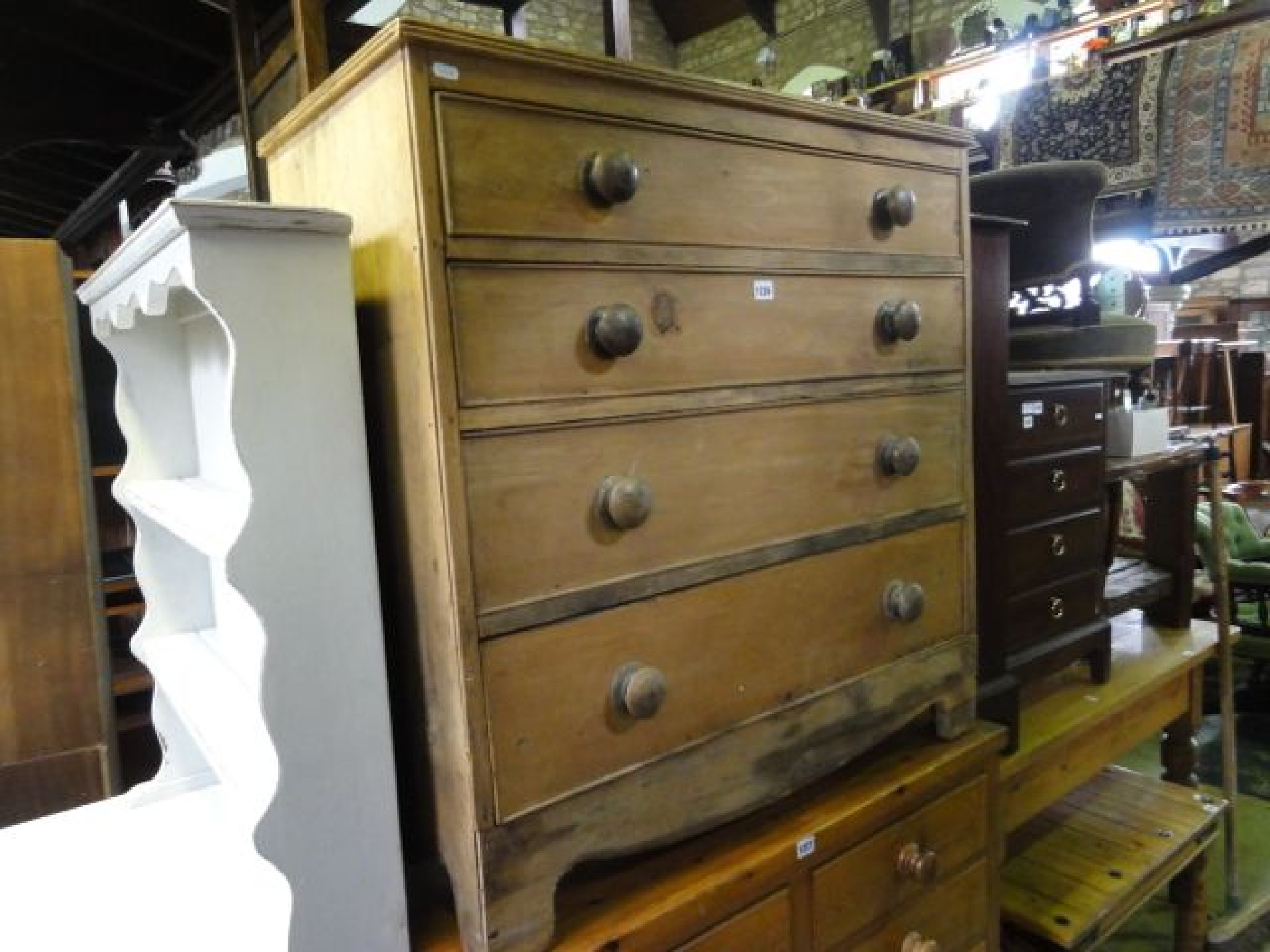 Appraisal: A th century stripped pine bedroom chest of four long