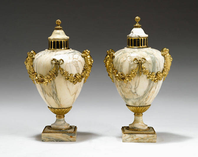 Appraisal: Pair of Louis XVI style gilt-bronze mounted marble urns Each