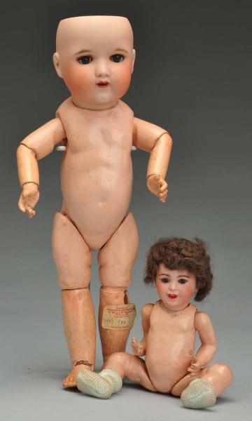 Appraisal: Lot of French Character Dolls Description Both with bisque socket