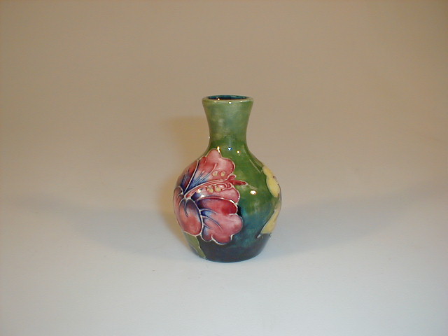 Appraisal: A Moorcroft pottery small bottle vase tube lined and painted