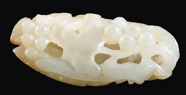 Appraisal: A white jade reticulated pebble th Century Of irregular oval