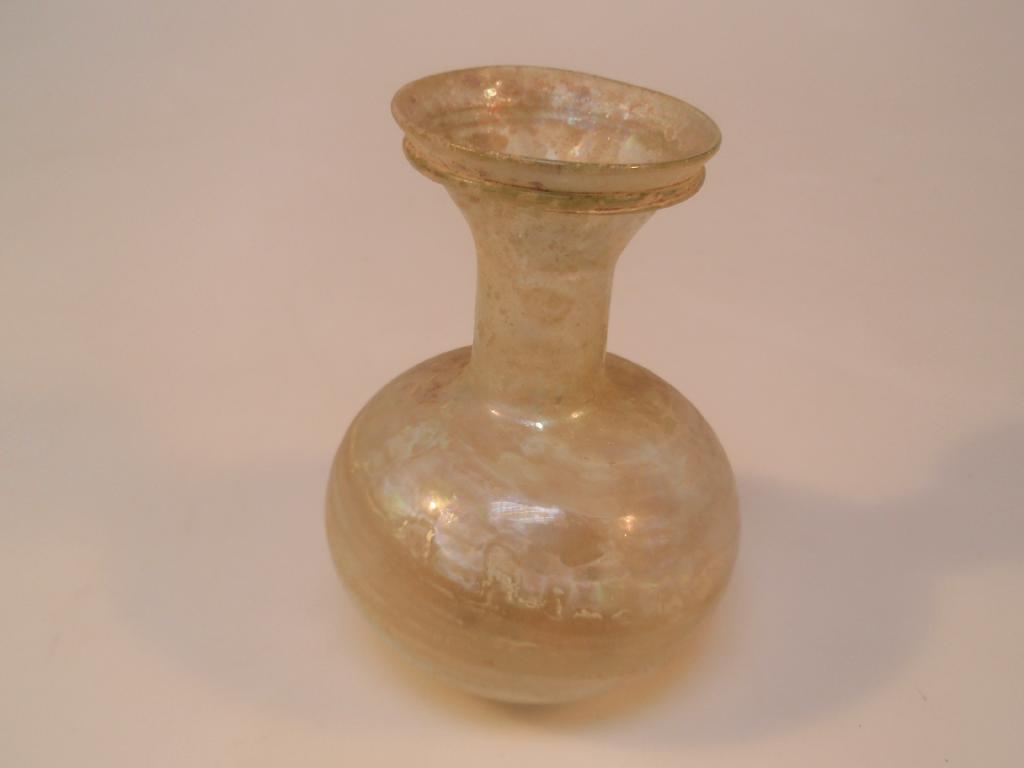 Appraisal: A Roman light yellowish-green glass flask the flaring mouth decorated