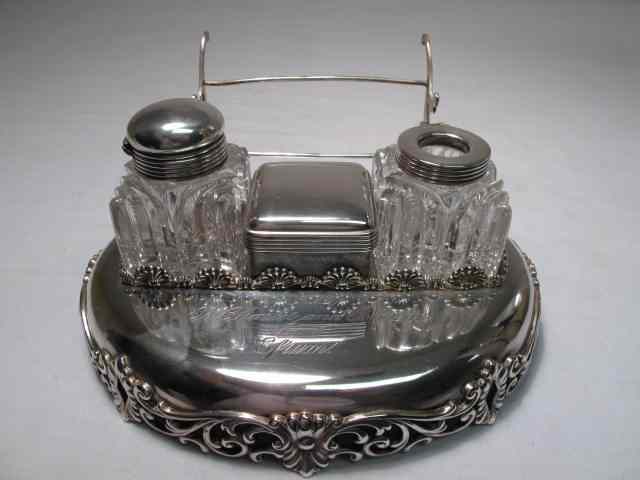 Appraisal: Sterling silver desk caddy with double crystal ink wells center