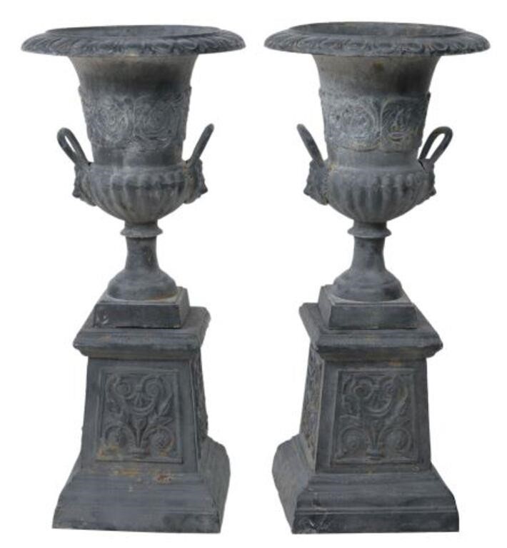 Appraisal: pair Classical style cast iron urn planters with handles removable