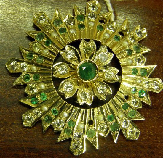 Appraisal: A DIAMOND EMERALD AND PEARL SET FLORAL STARBURST PENDANT