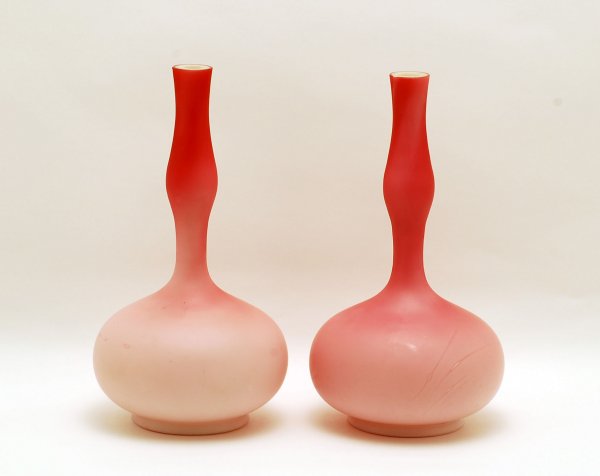 Appraisal: Pair of Victorian satin glass stick vases cased red over