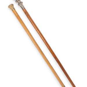 Appraisal: Two Metal Mounted Walking Sticks Early th Century comprising a