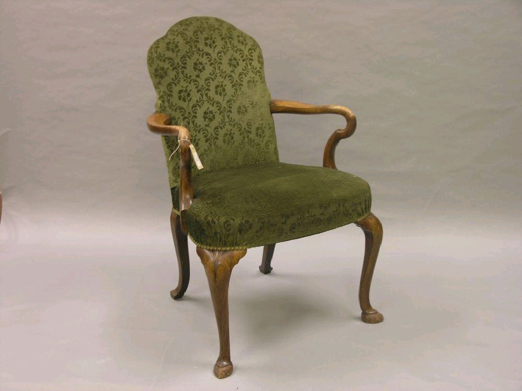 Appraisal: A walnut upholstered armchair with shepherd's crook arms on four