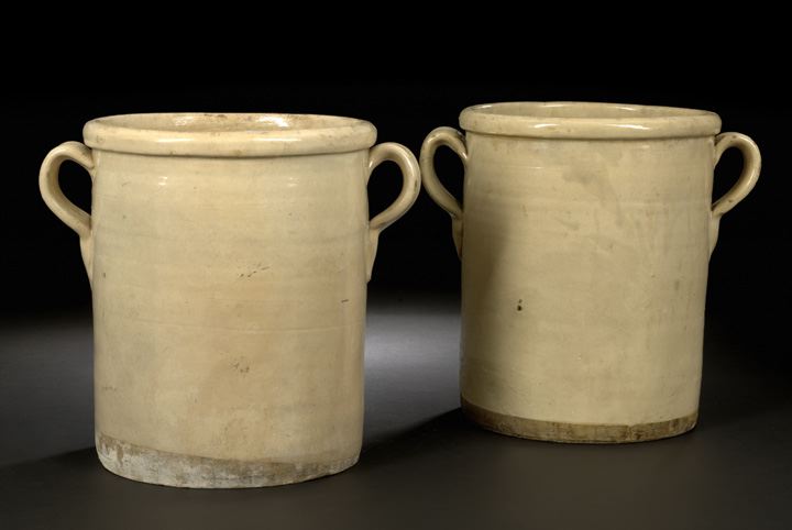 Appraisal: Pair of Northern European Provincial Ivory-Glazed Pottery Two-Handled Storage Crocks