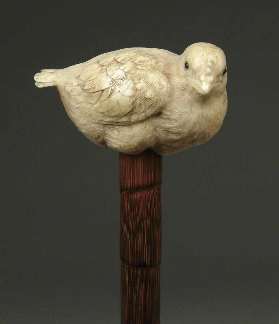 Appraisal: CARVED IVORY BROODING DOVE CANE Oriental carved bird has inset