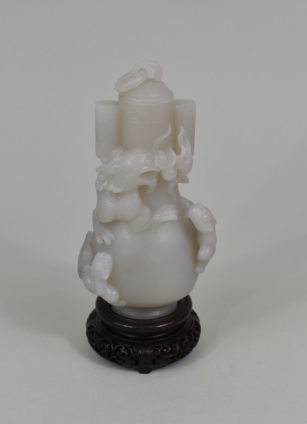 Appraisal: CHINESE TRANSLUCENT WHITE JADE COVERED VASEThe baluster vessel with a