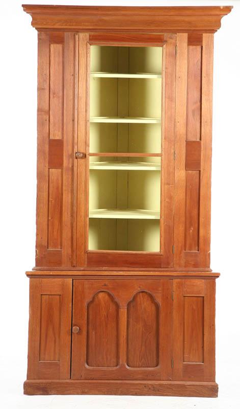 Appraisal: CORNER CUPBOARD Two piece walnut cupboard with a step molded